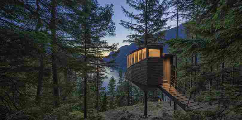 Rest your head in a cosy Norwegian forest treehouse overlooking a fjord